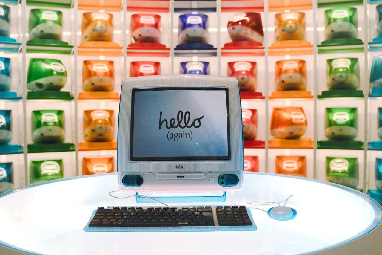 About Retro Apple iMac G3 display showcasing technology evolution with colorful computer units.